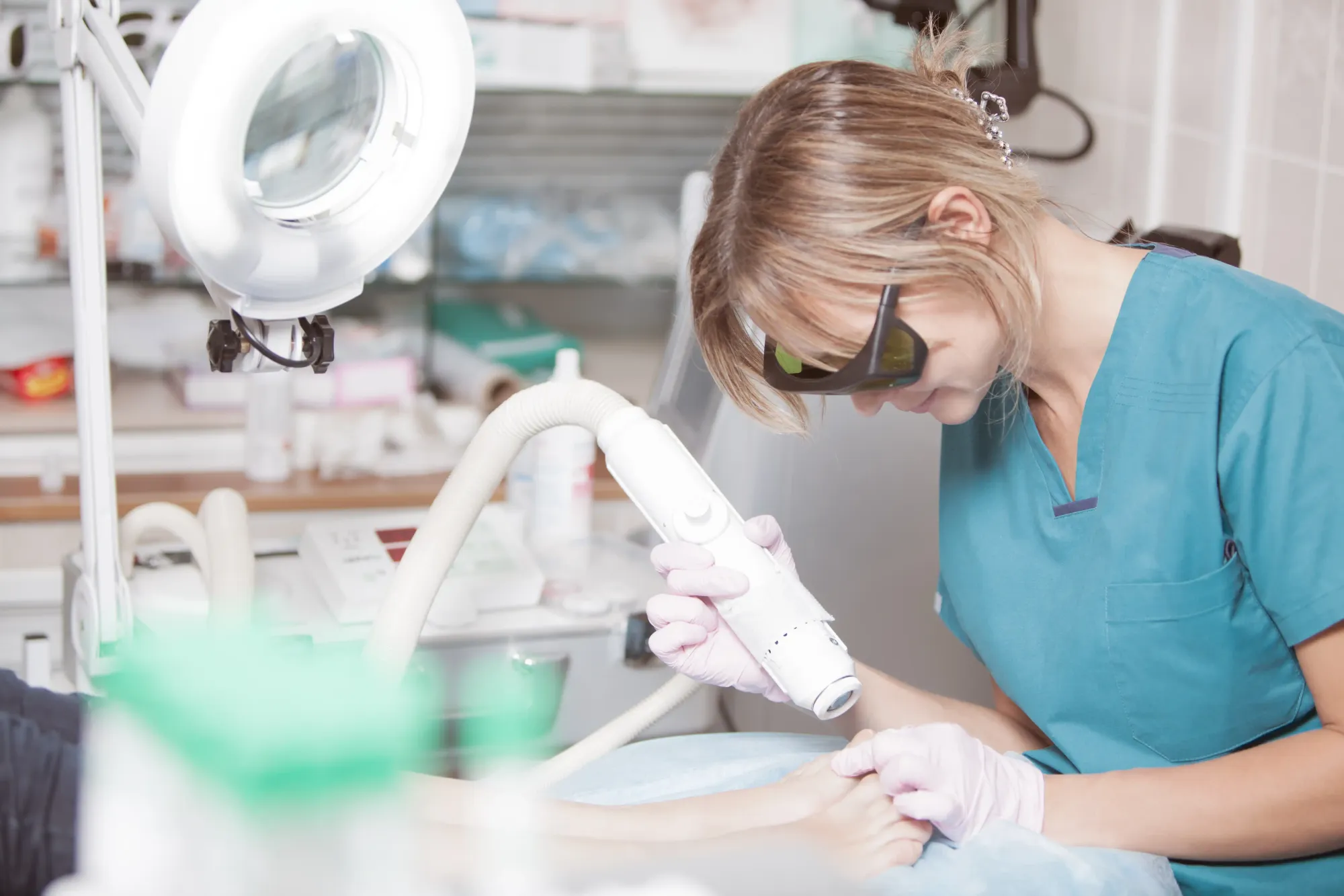 A woman doing laser treatment at clinic